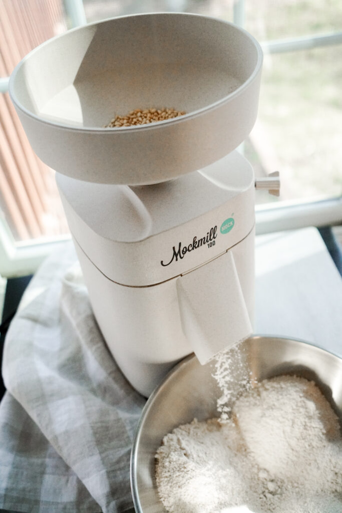 Grain mill milling wheat berries into flour